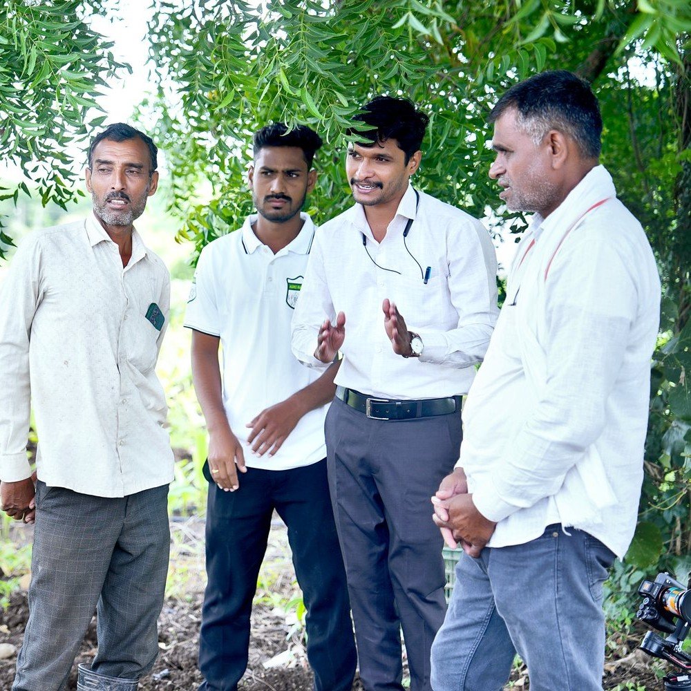 Leadership working directly in the field with farmers